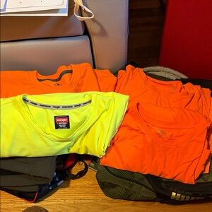 Bright Yellow and Orange long sleeve shirts and 1 is a sweatshirt